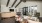 clubroom with large windows, seating areas and a large tv