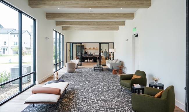 Experience it All Lounge room with chairs and beam ceilings